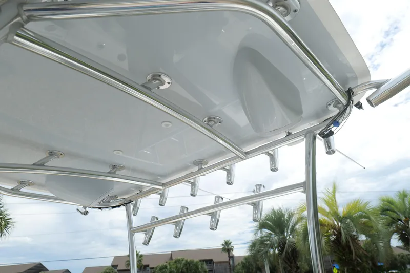  Yacht Photos Pics 2024 Contender 35 ST boat's sleek T-top with rod holders and stainless steel frame.