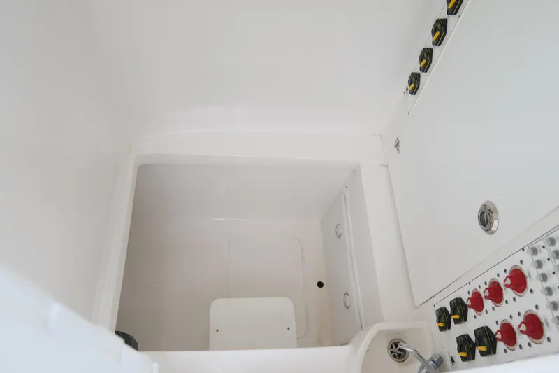  Yacht Photos Pics 2024 Contender 35 ST boat interior with control panel and storage compartment.