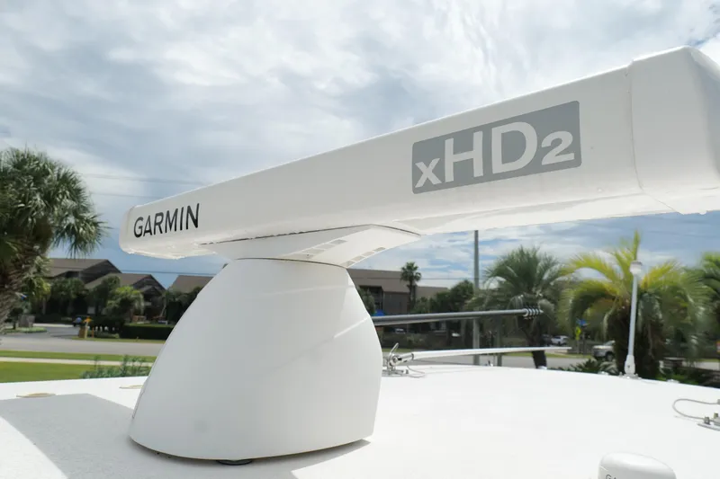  Yacht Photos Pics Garmin xHD2 radar on 2024 Contender 35 ST boat, surrounded by palm trees.