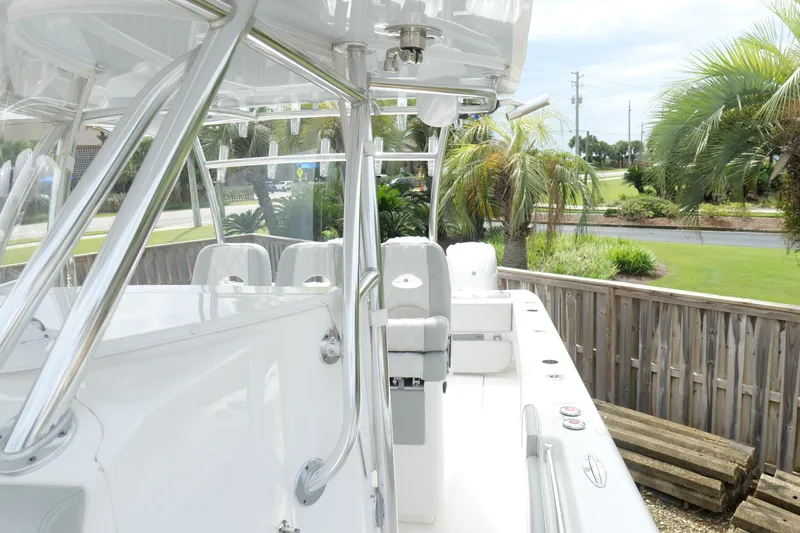  Yacht Photos Pics 2024 Contender 35 ST boat with sleek design, featuring polished metal framework and comfortable seating.