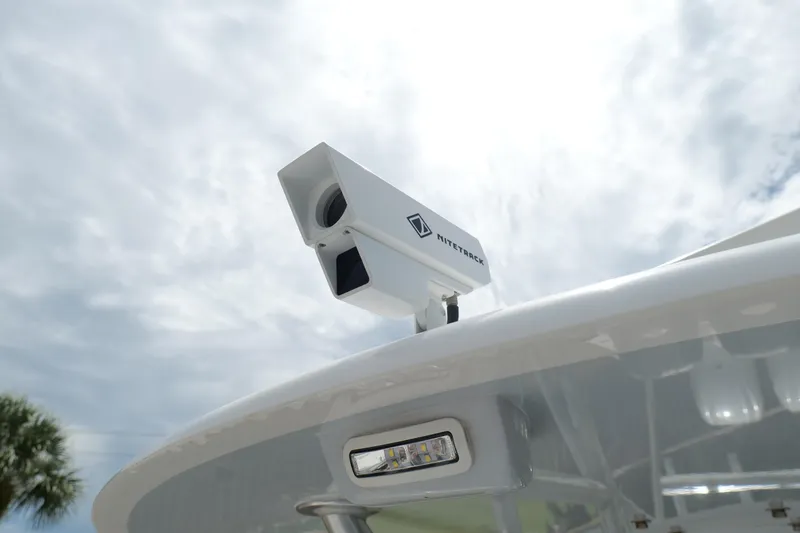  Yacht Photos Pics 2024 Contender 35 ST boat with NiteTrack camera system under cloudy sky.