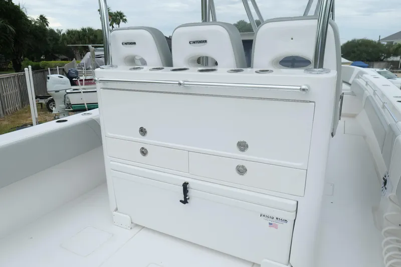  Yacht Photos Pics 2024 Contender 35 ST boat interior with seating and storage compartments.