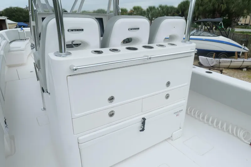  Yacht Photos Pics 2024 Contender 35 ST boat interior with seating and storage compartments.