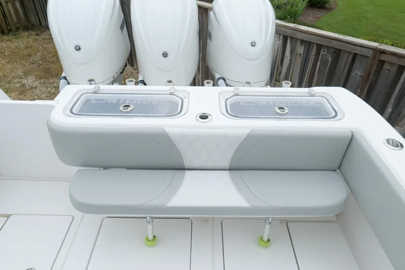  Yacht Photos Pics 2024 Contender 35 ST boat with triple outboard engines and cushioned seating.