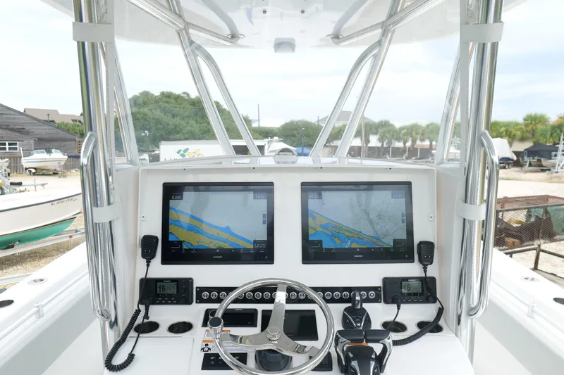  Yacht Photos Pics 2024 Contender 35 ST boat dashboard with dual navigation screens and controls.