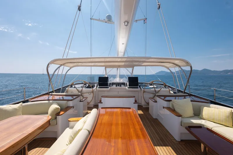 Drumbeat Yacht Photos Pics Luxurious deck of 2002 Alloy Yachts Sailing Ketch DRUMBEAT, featuring elegant seating and ocean views.