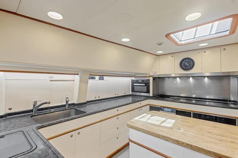 Drumbeat Yacht Photos Pics Luxurious kitchen interior of 2002 Alloy Yachts Sailing Ketch DRUMBEAT with modern appliances.