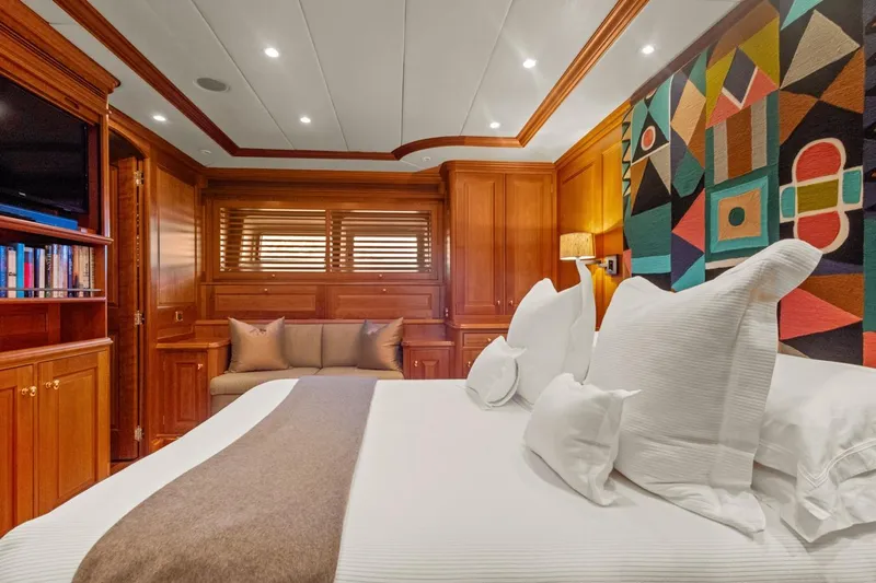 Drumbeat Yacht Photos Pics Luxurious cabin interior of 2002 Alloy Yachts Sailing Ketch DRUMBEAT with vibrant wall art.