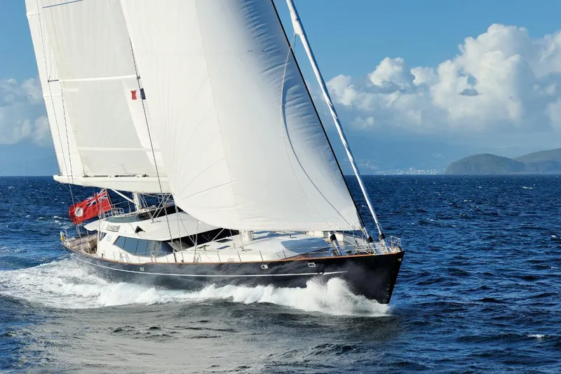Drumbeat Yacht Photos Pics Sailing yacht "DRUMBEAT" by Alloy Yachts, 2002, navigating ocean waves under clear skies.