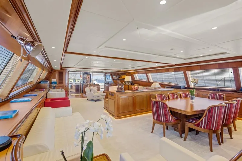 Drumbeat Yacht Photos Pics Luxurious interior of 2002 Alloy Yachts Sailing Ketch DRUMBEAT with elegant dining area and seating.