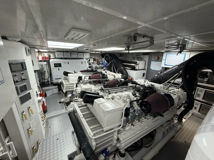 Integrity Yacht Photos Pics Engine room of 2002 Westport 112 Raised Pilot House yacht, featuring dual engines and control panels.