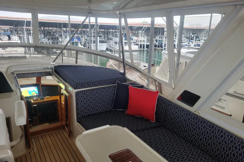 Miss Daisy Yacht Photos Pics Luxurious 2005 Fleming Pilothouse interior with plush seating and marina view.