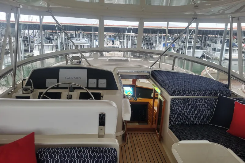 Miss Daisy Yacht Photos Pics Pilothouse interior of 2005 Fleming yacht with Garmin navigation, docked at marina.