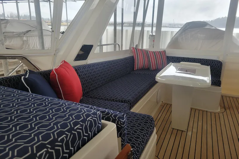 Miss Daisy Yacht Photos Pics Luxurious 2005 Fleming Pilothouse yacht interior with patterned seating and vibrant cushions.