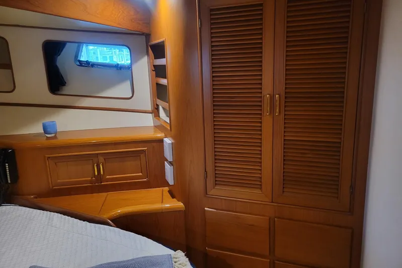 Miss Daisy Yacht Photos Pics 2005 Fleming Pilothouse interior with wooden cabinetry and window.