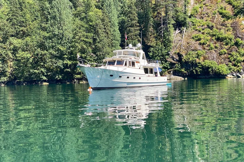 Miss Daisy Yacht Photos Pics Fleming yacht from 2005 on a serene, forested lake.