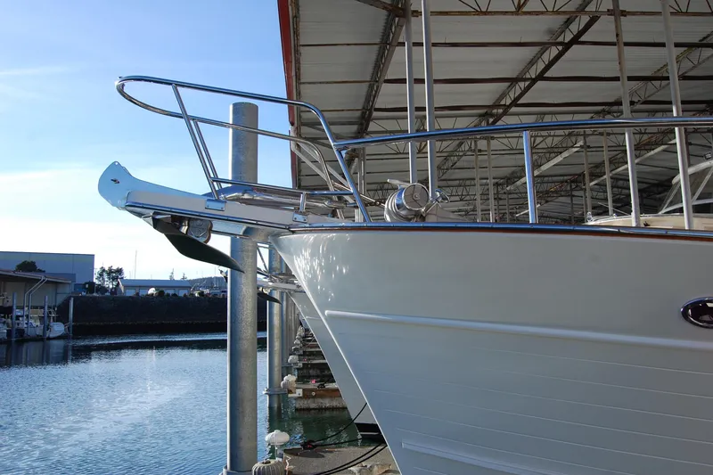 Miss Daisy Yacht Photos Pics Bow of a 2005 Fleming yacht docked in a marina under a covered structure.