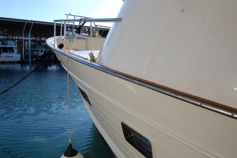 Miss Daisy Yacht Photos Pics Luxury Fleming yacht docked at marina, 2005 model, with sleek white exterior.