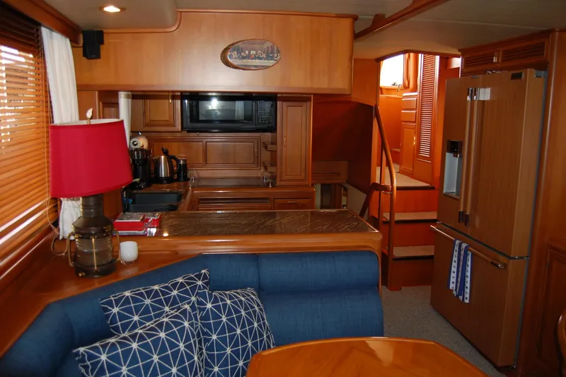 Miss Daisy Yacht Photos Pics Luxurious 2005 Fleming yacht interior with kitchen, dining area, and modern appliances.