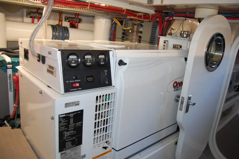 Miss Daisy Yacht Photos Pics Engine room of a 2005 Fleming yacht featuring an Onan generator.
