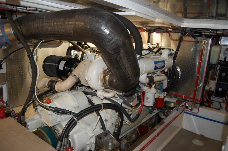 Miss Daisy Yacht Photos Pics Engine room of a 2005 Fleming boat, showcasing complex machinery and piping.