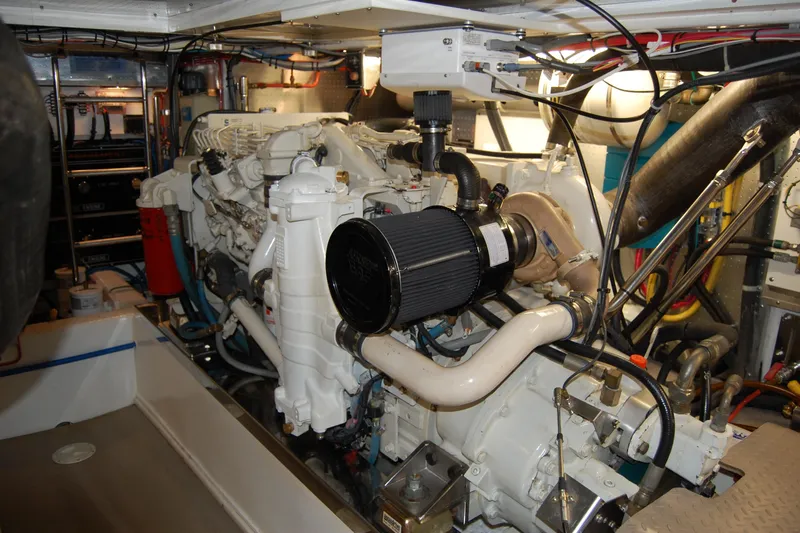 Miss Daisy Yacht Photos Pics Engine room of a 2005 Fleming boat, showcasing complex machinery and wiring.