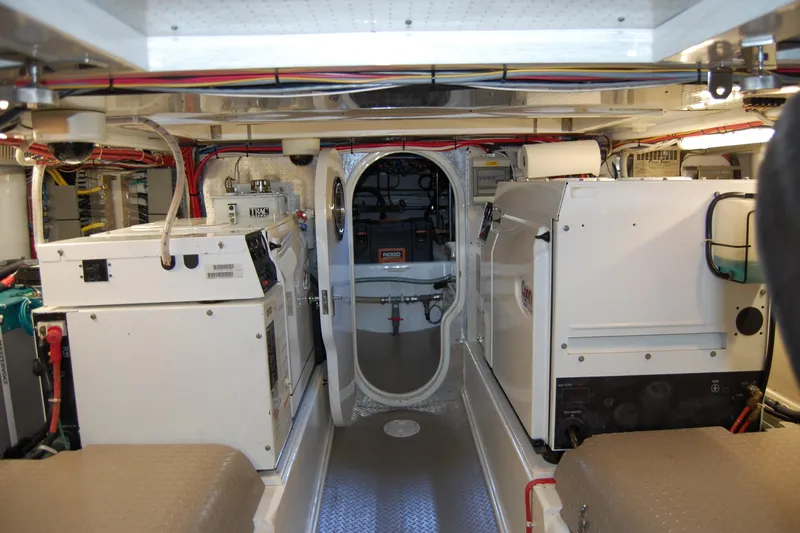 Miss Daisy Yacht Photos Pics Engine room of a 2005 Fleming boat, featuring machinery and wiring.