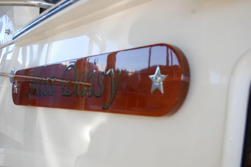 Miss Daisy Yacht Photos Pics Nameplate on a 2005 Fleming boat, reading "Miss Daisy" with star decorations.