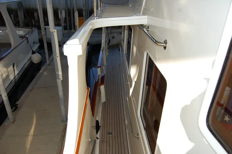 Miss Daisy Yacht Photos Pics Side deck of a 2005 Fleming yacht, featuring sleek design and polished railings.