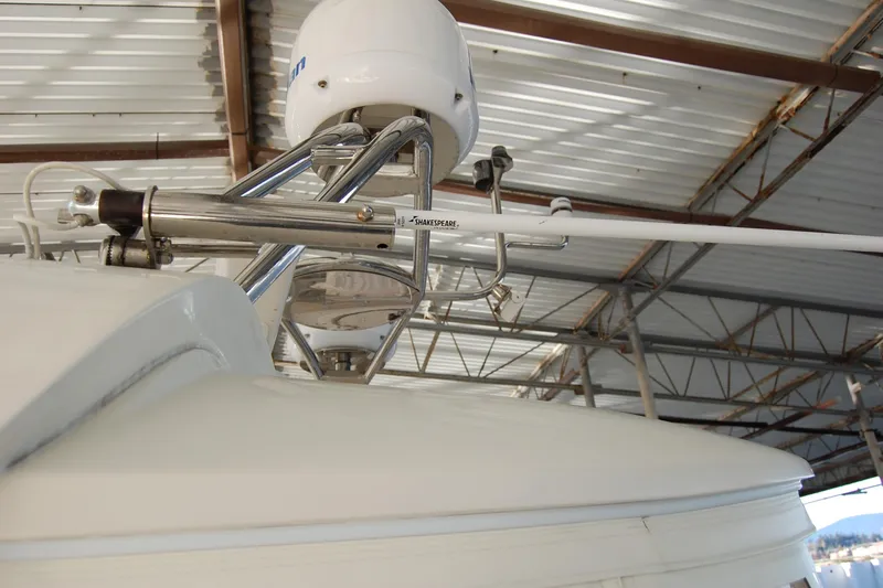 Miss Daisy Yacht Photos Pics Close-up of a 2005 Fleming boat's radar and antenna system under a metal roof.