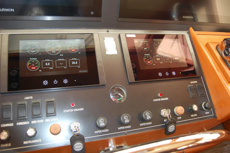Miss Daisy Yacht Photos Pics Control panel of a 2005 Fleming boat with digital displays and switches.