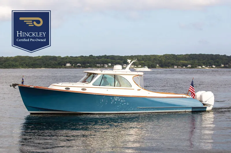 Sublime Yacht Photos Pics Hinckley 35 yacht, 2022 model, certified pre-owned, cruising on calm waters.