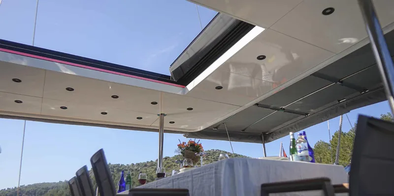  Yacht Photos Pics Outdoor dining area on 2023 Gulet yacht with scenic views and modern design.