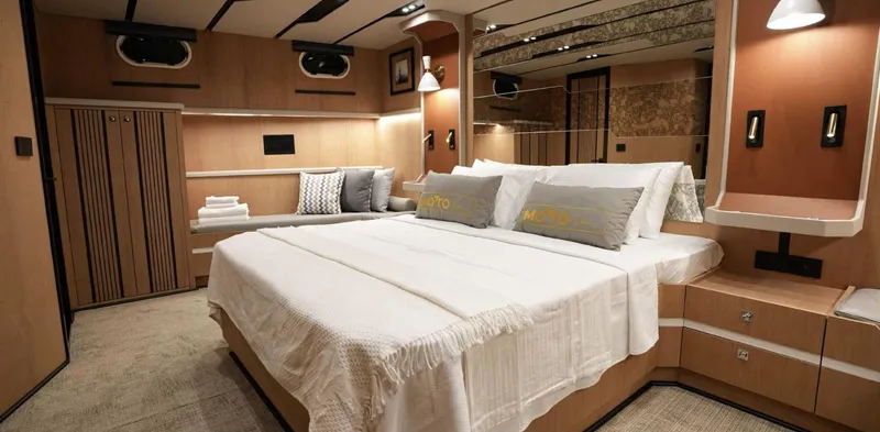  Yacht Photos Pics Luxurious 2023 Gulet yacht bedroom with modern design and cozy bedding.