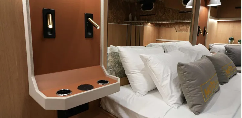  Yacht Photos Pics Luxurious 2023 Gulet yacht cabin with modern design, plush bedding, and elegant lighting.