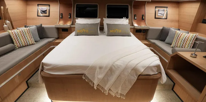  Yacht Photos Pics Luxurious 2023 Gulet yacht cabin with cozy bed and elegant decor.