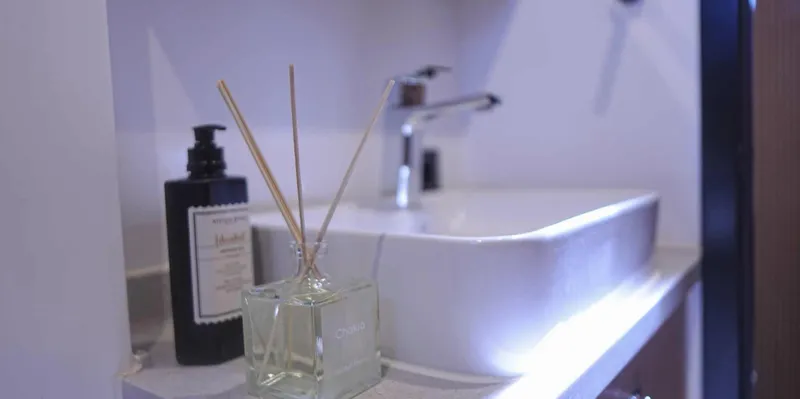  Yacht Photos Pics Modern bathroom sink with soap dispenser and reed diffuser on a Gulet yacht, 2023 model.