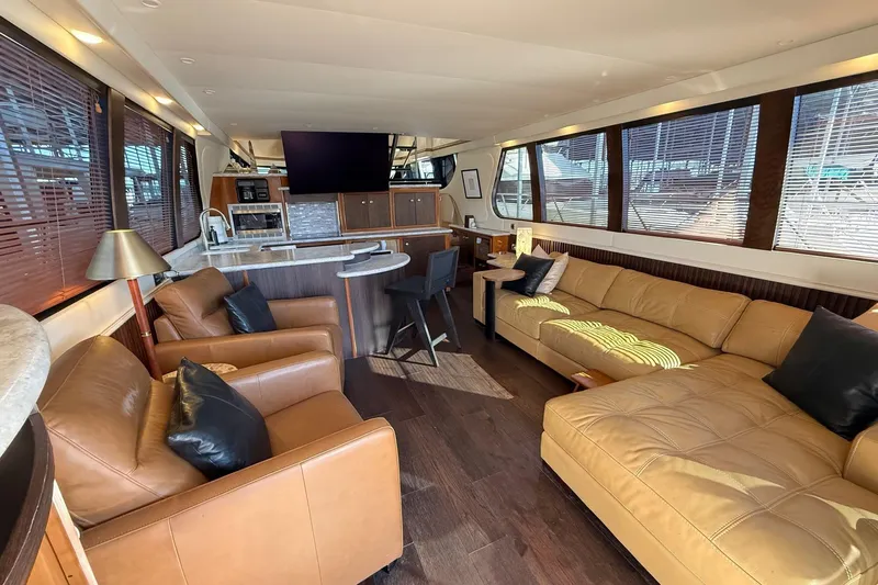  Yacht Photos Pics Luxurious interior of 2002 Carver 570 Voyager Pilothouse with leather seating and modern amenities.