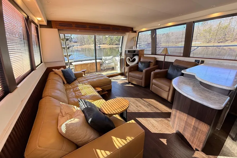  Yacht Photos Pics Luxurious interior of 2002 Carver 570 Voyager Pilothouse with leather seating and scenic views.