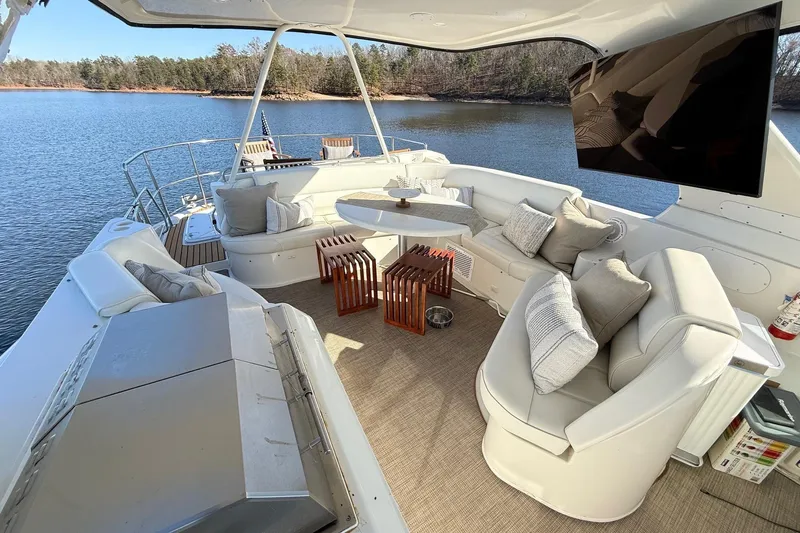  Yacht Photos Pics Luxurious 2002 Carver 570 Voyager Pilothouse yacht interior with plush seating and scenic water view.