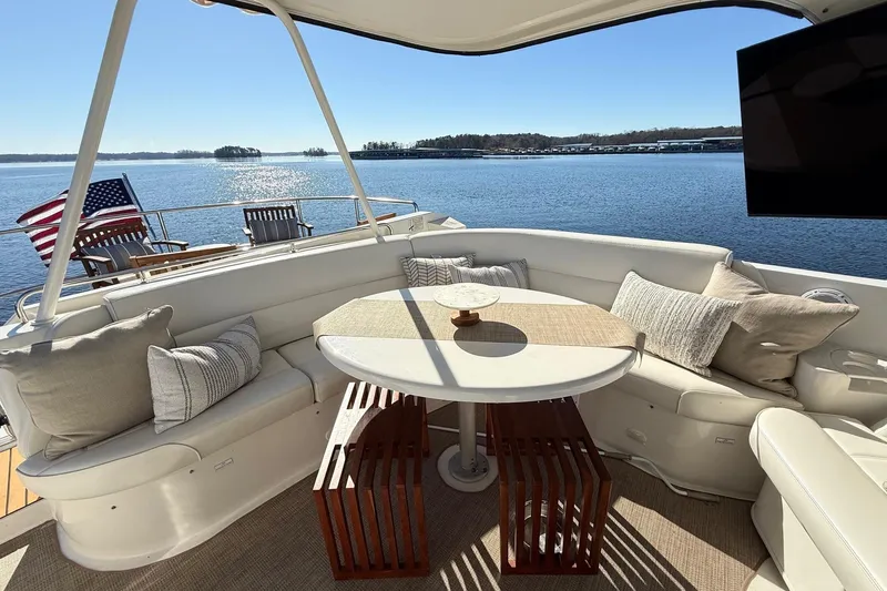  Yacht Photos Pics Luxurious seating area on 2002 Carver 570 Voyager Pilothouse yacht with scenic water view.