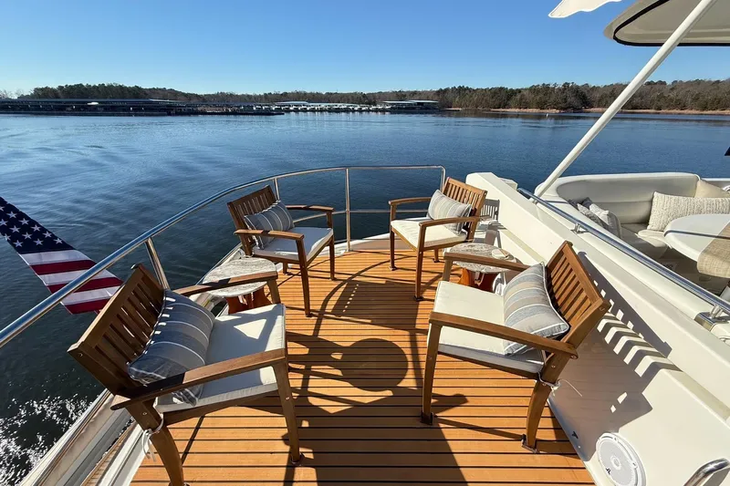  Yacht Photos Pics Luxurious 2002 Carver 570 Voyager Pilothouse yacht deck with elegant seating and scenic water view.