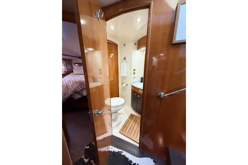 Yacht Photos Pics Luxurious bathroom in 2002 Carver 570 Voyager Pilothouse yacht with wooden accents.