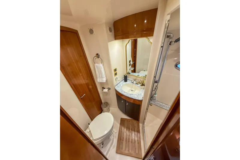  Yacht Photos Pics Luxurious bathroom in 2002 Carver 570 Voyager Pilothouse yacht with elegant fixtures.
