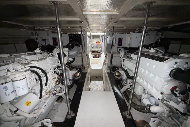  Yacht Photos Pics Engine room of 2002 Carver 570 Voyager Pilothouse with dual engines and mechanical components.