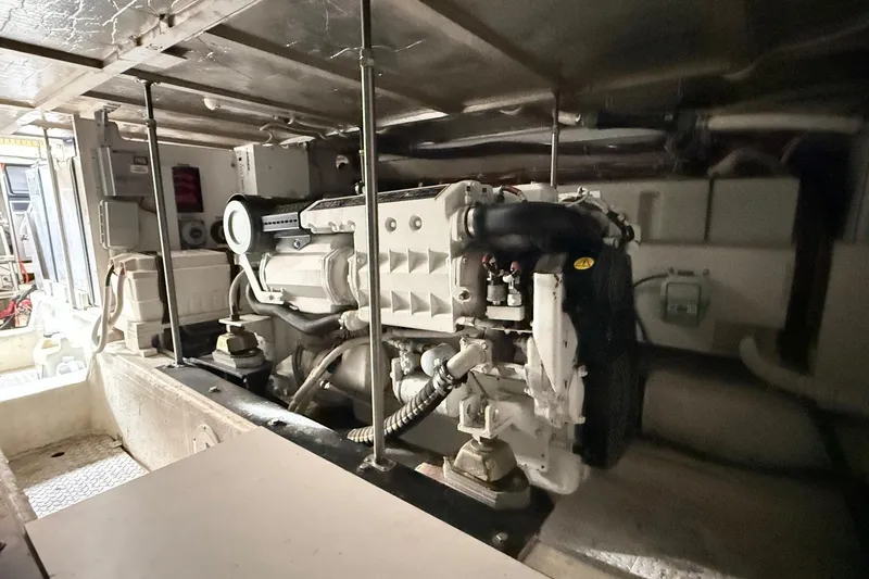  Yacht Photos Pics Engine room of 2002 Carver 570 Voyager Pilothouse, showcasing mechanical components and systems.