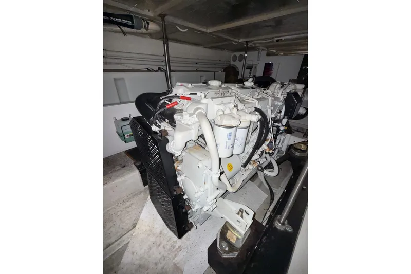  Yacht Photos Pics Engine room of 2002 Carver 570 Voyager Pilothouse, showcasing marine engine components.