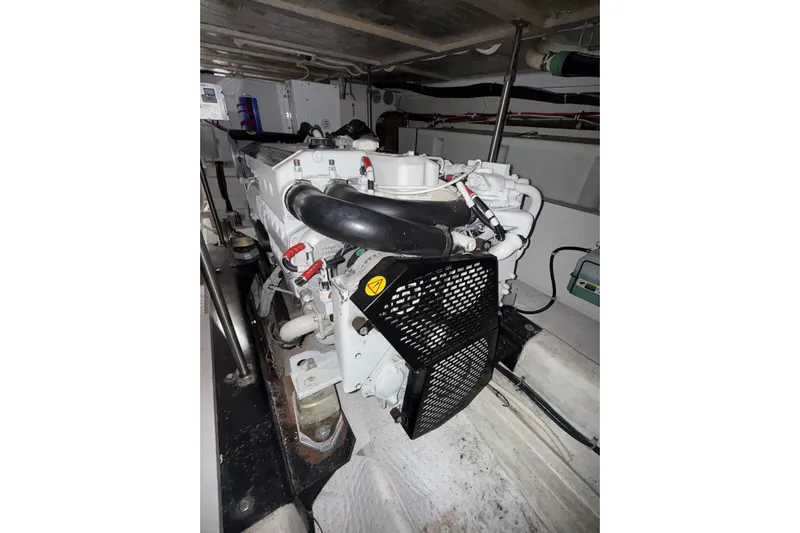  Yacht Photos Pics Engine room of 2002 Carver 570 Voyager Pilothouse yacht, showcasing machinery and components.