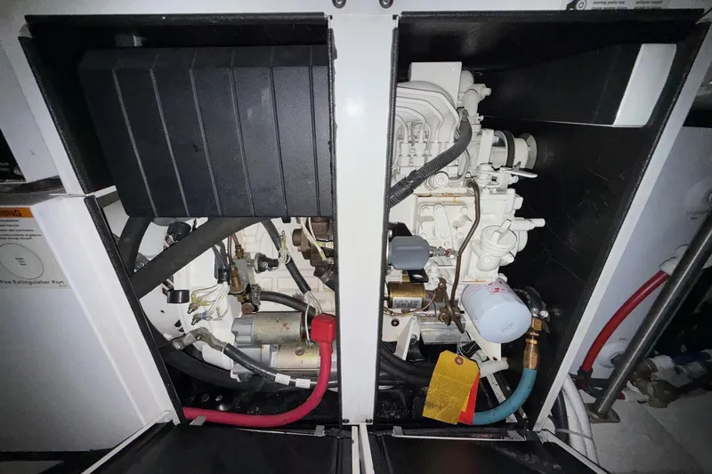  Yacht Photos Pics Engine compartment of a 2002 Carver 570 Voyager Pilothouse, showcasing mechanical components.