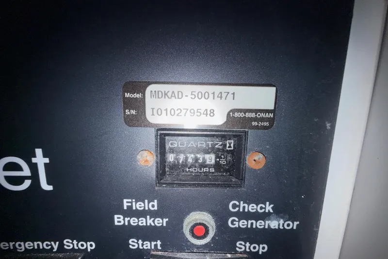  Yacht Photos Pics Control panel of a 2002 Carver 570 Voyager Pilothouse with hour meter and model details.